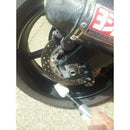Alloy Wheel Metal Polishing tool buffing a glossy black motorcycle wheel with a handheld drill attachment