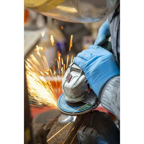 Angle Grinder Polishing with blue abrasive disc and metal grinder producing sparks on steel
