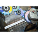 Angle Grinder Polishing with blue abrasive flap discs and a spinning disc smoothing a metal bar