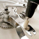 Drill Steel And Stainless Steel polishing kit with a white cylindrical buffing wheel polishing shiny metal parts