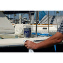 Peek Metal Polish tin shown beside a person polishing a white boat surface with a cloth