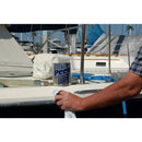 Peek Metal Polish in a white tube shown being applied to a boat surface with a cloth
