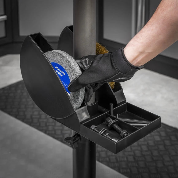 Sealey Bench Grinder Stand with black metal frame, grinding wheel compartments and an accessory tray holding tools