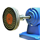 Variable Speed Mini Bench Grinder with a blue metal housing and a layered black and cream polishing wheel